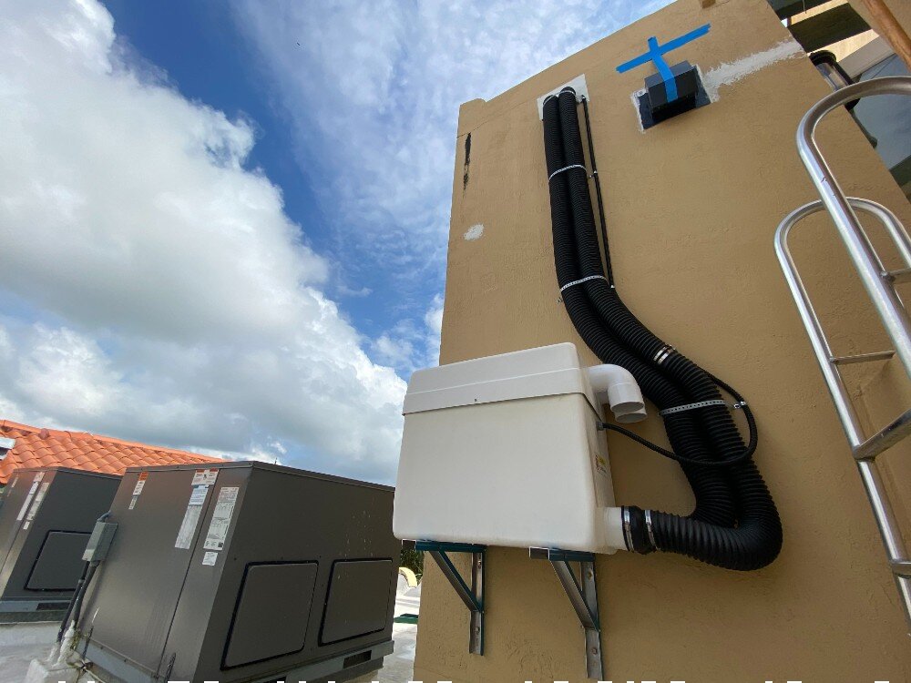 Compact outdoor split-unit machinery for residential vacuum elevators