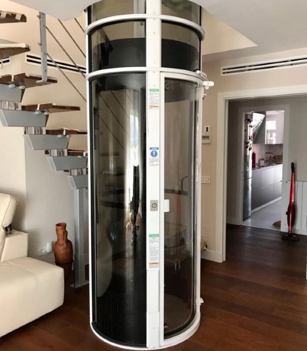 Compact residential vacuum elevator providing safe and convenient access between floors.