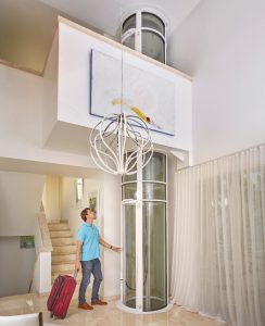 Pneumatic vacuum elevator powered by air pressure in a modern home