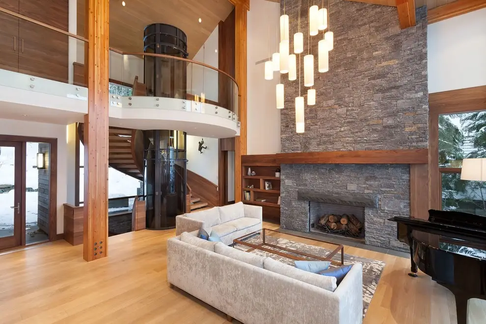 Luxury home featuring a panoramic vacuum elevator integrated into an open-concept living space for long-term accessibility and convenience.
