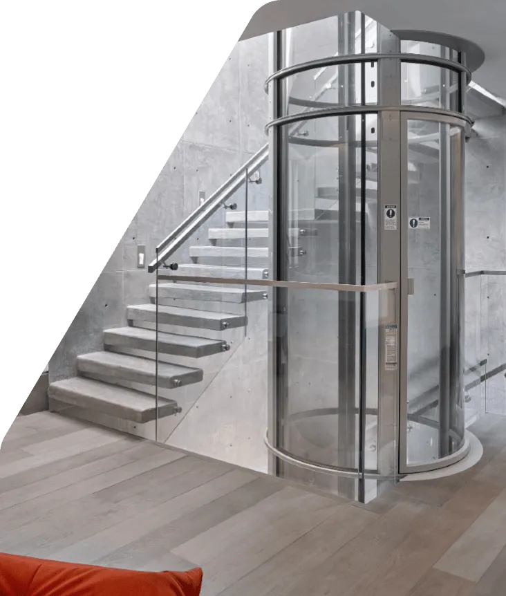 PVE glass vacuum elevator in a contemporary home interior with floating stairs